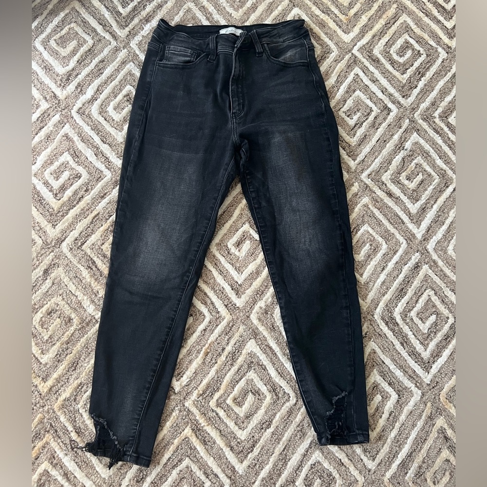 Black buckle skinny jeans